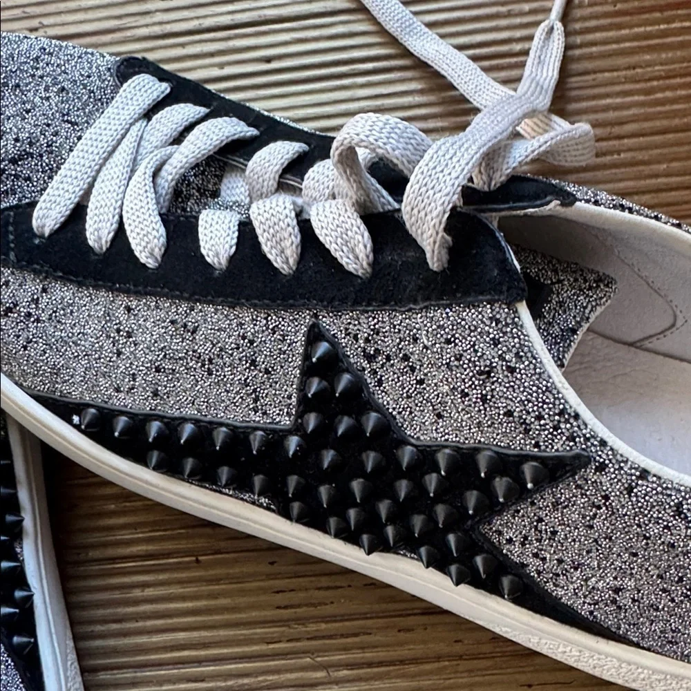Lola Cruz silver metallic sneakers with a black raised star